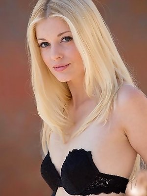 It's too beautiful out to just sit inside, and far too gorgeous of a day for Charlotte Stokely to keep her clothes on. There's a stiff wind 